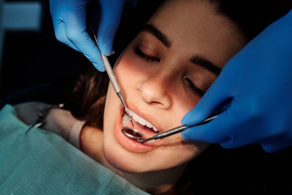 Female patient undergoing wisdom teeth removal procedure