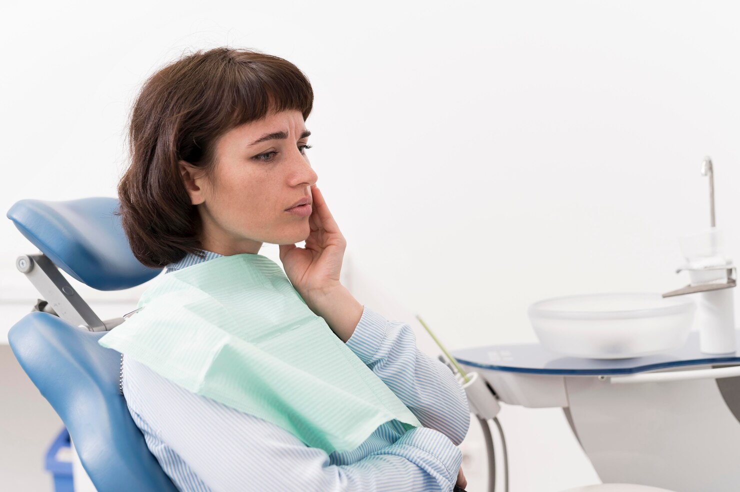 Woman consulting dentist about wisdom teeth removal